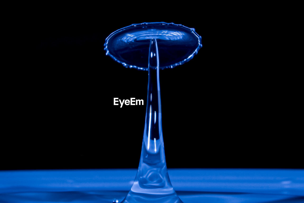 CLOSE-UP OF WATER DROP ON GLASS