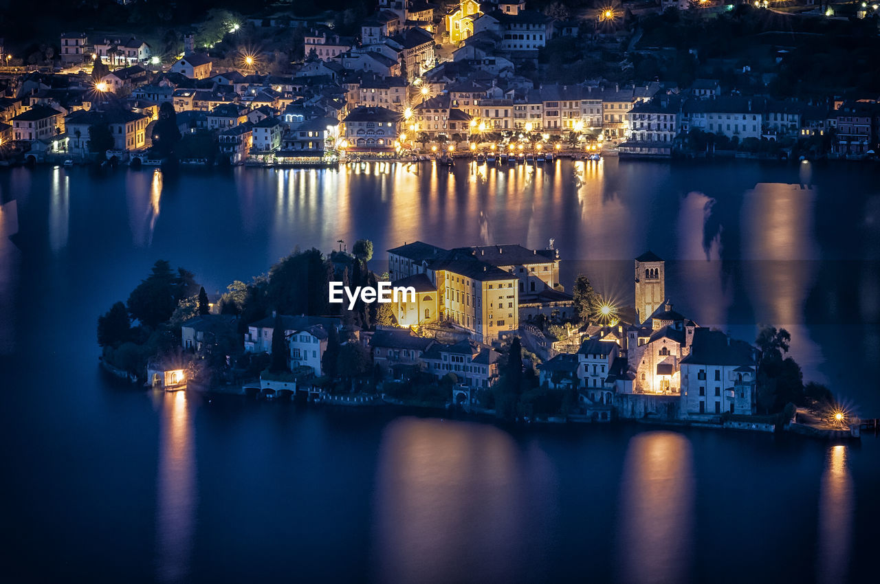 High angle view of illuminated isola san giulio at night