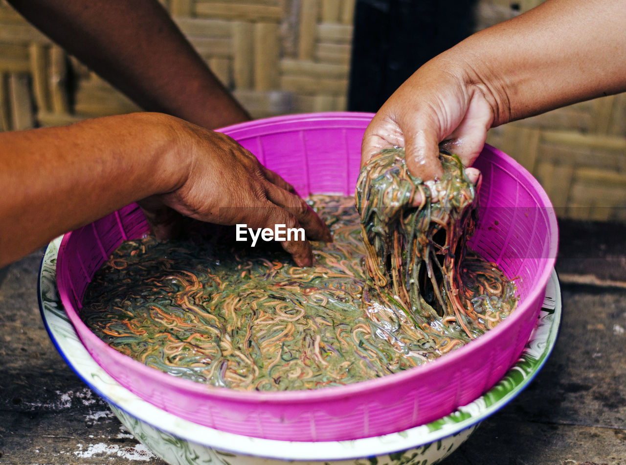 Midsection of person preparing food