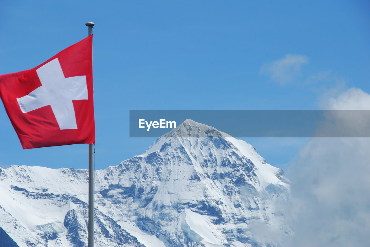 Scenic view of snow covered mountains against sky