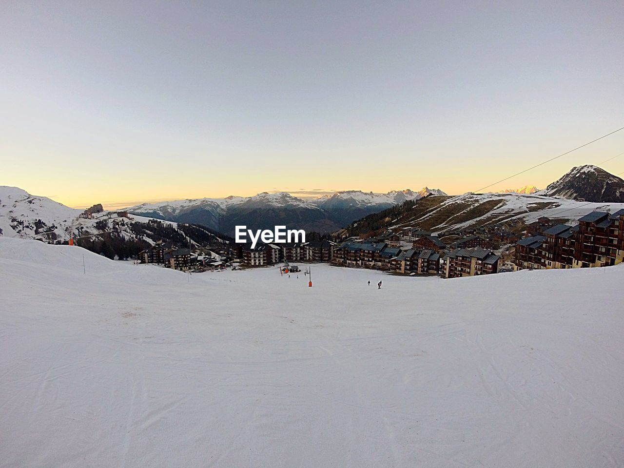 Scenic view of snow covered mountains against sky