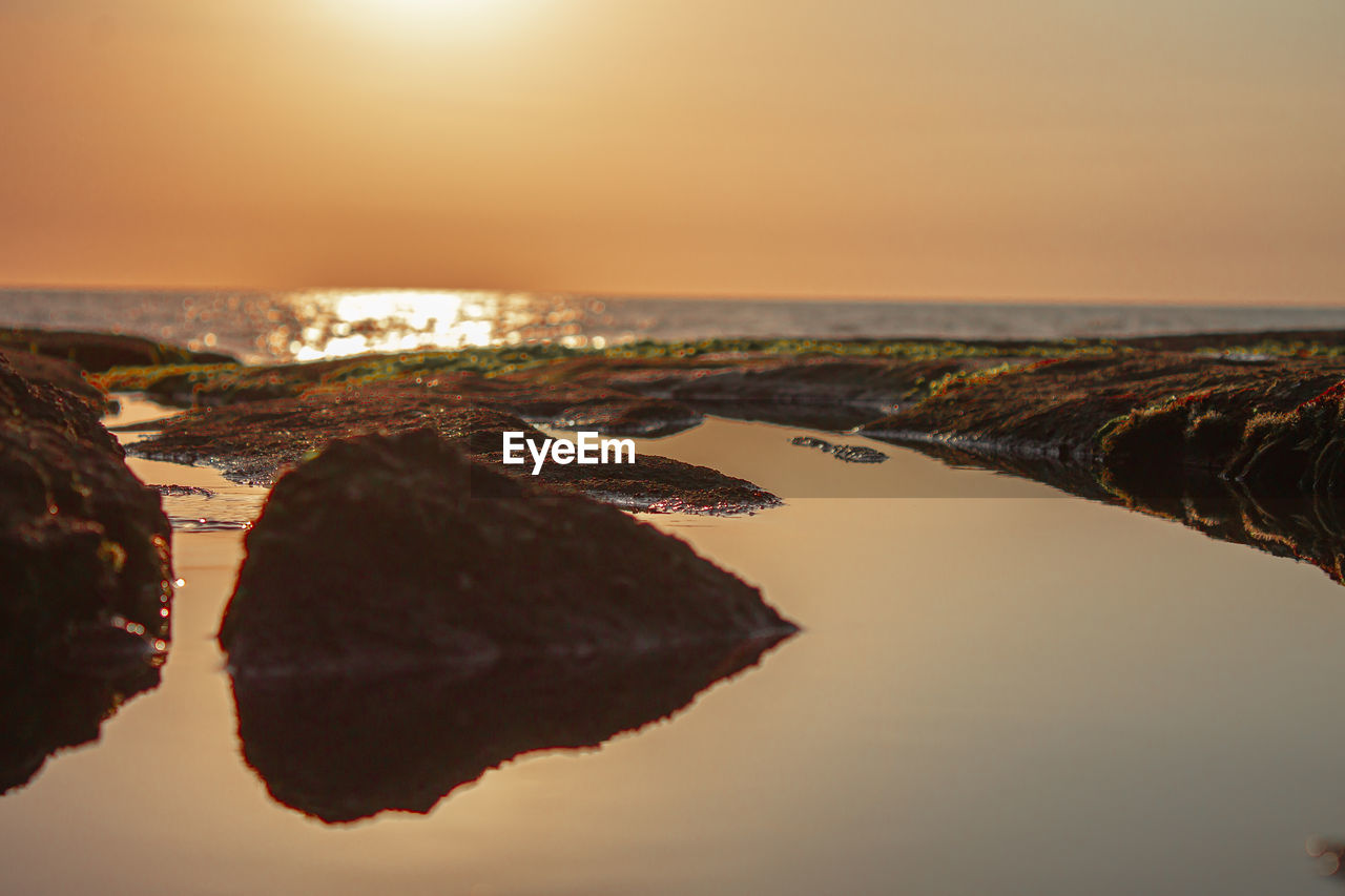 Scenic view of sea against sky during sunset