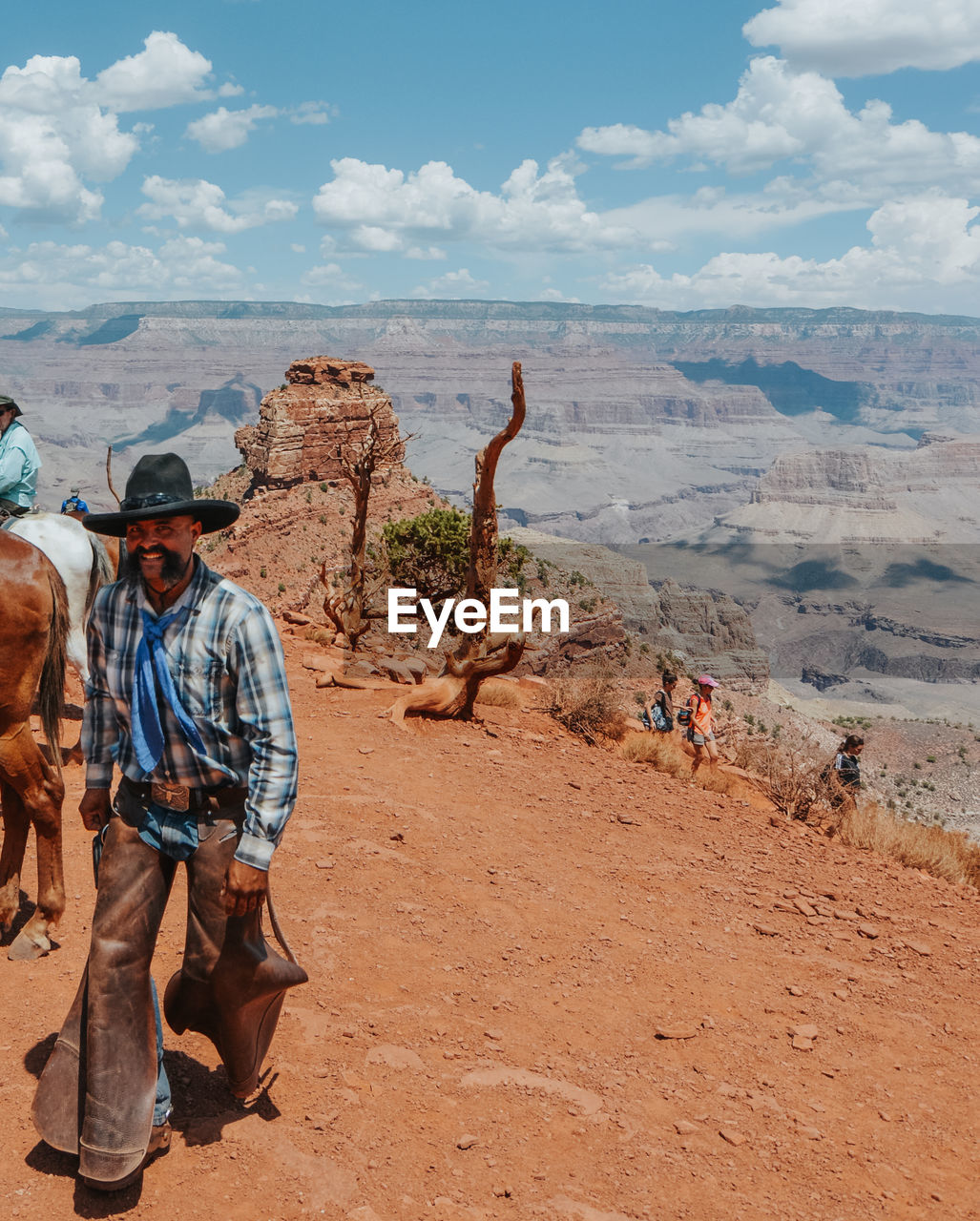 PANORAMIC VIEW OF TOURISTS ON LANDSCAPE