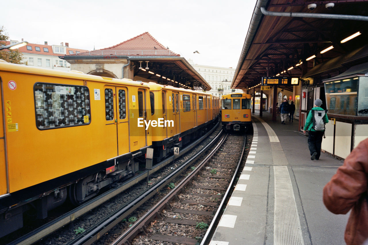 Train at railroad station against sky