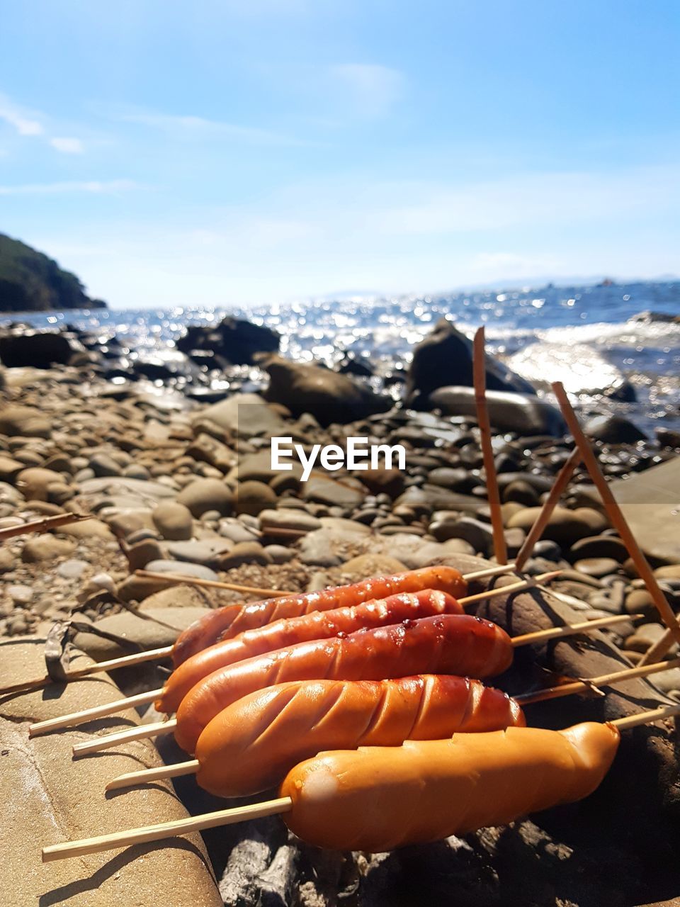 CLOSE-UP OF ORANGE ON BEACH