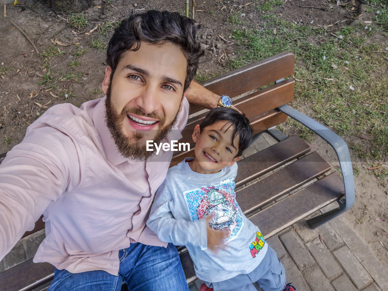 Portrait of happy family sitting outdoors