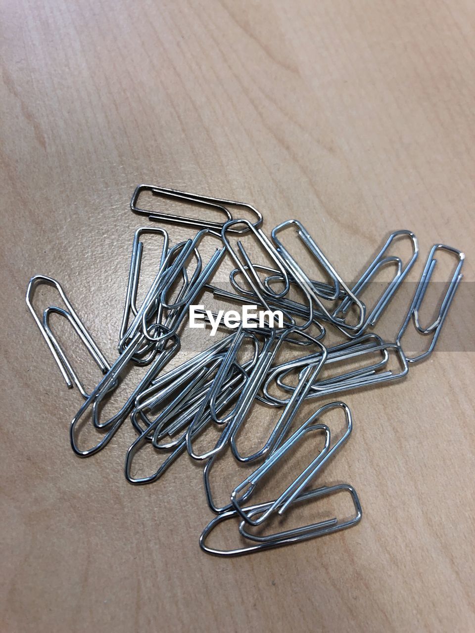 High angle view of paper clips on table