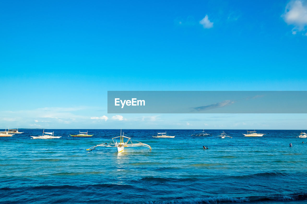 Boats in calm sea