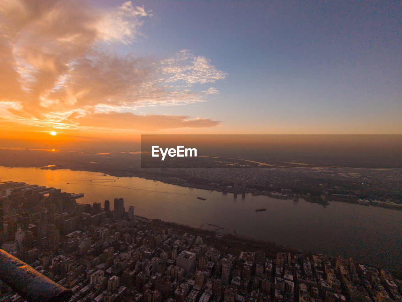 high angle view of cityscape against sky during sunset