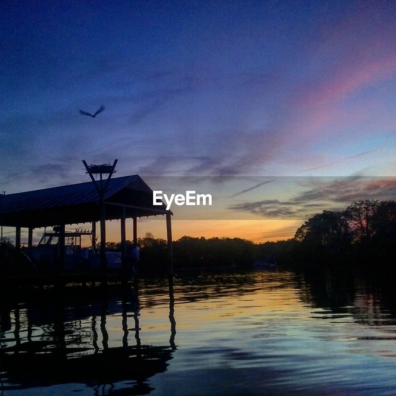 Scenic view of lake at sunset