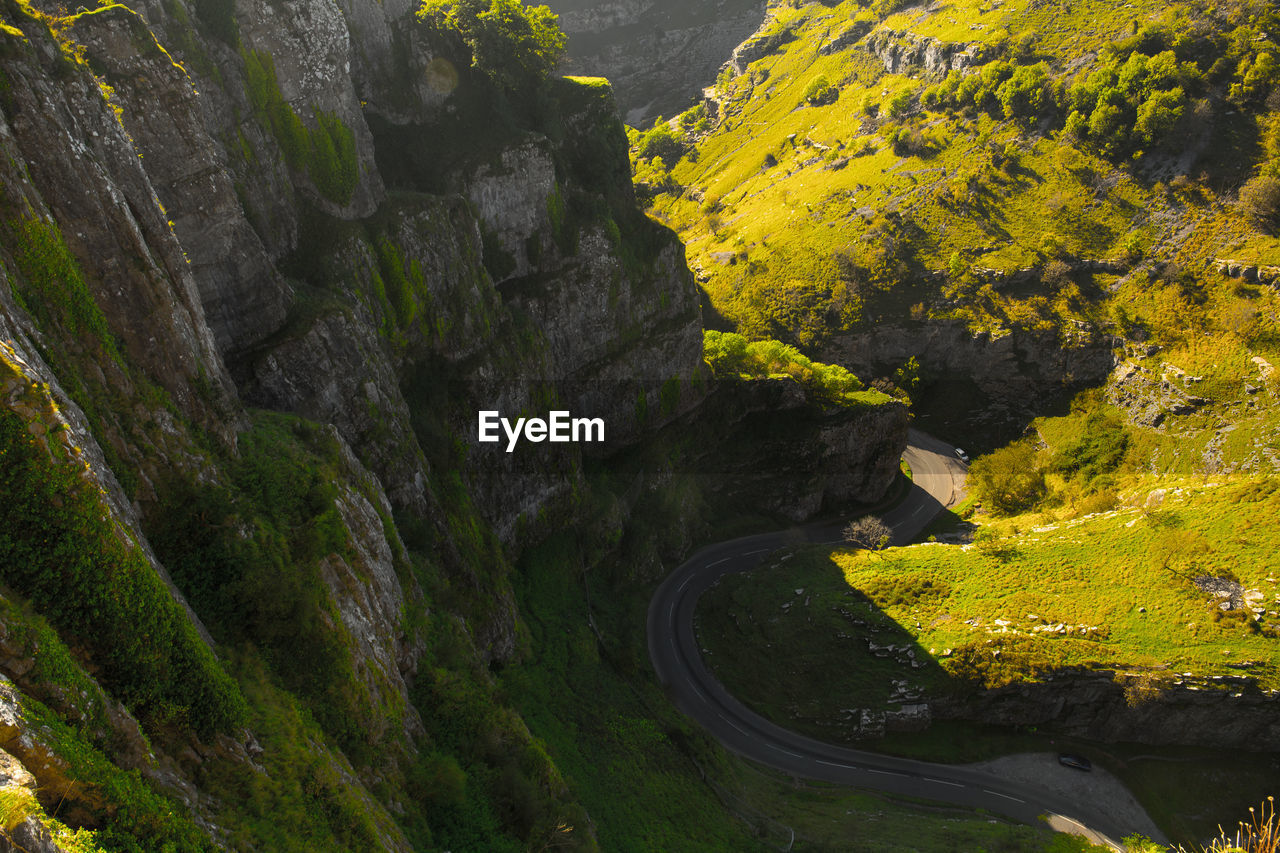 Aerial view of winding road amidst mountains