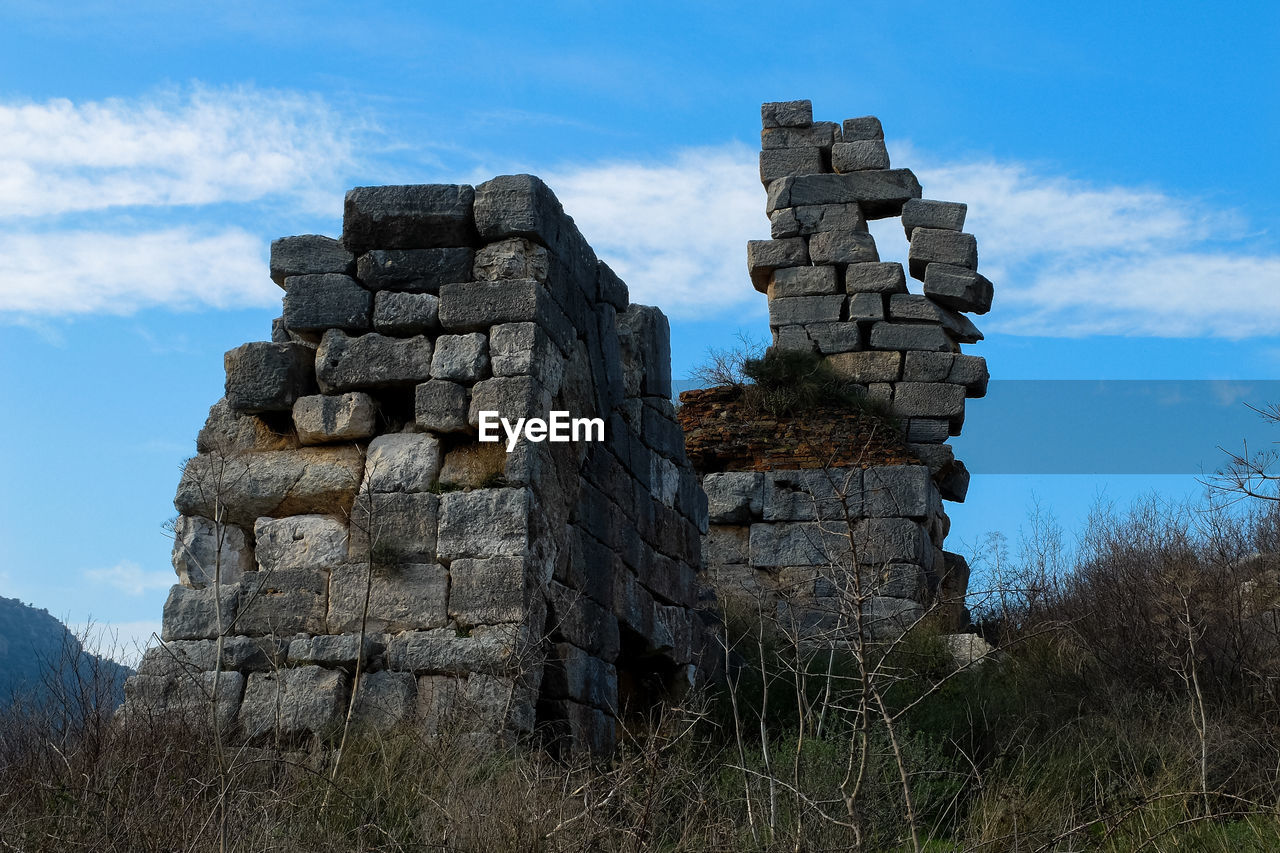 Low angle vie of old ruin against blue sky