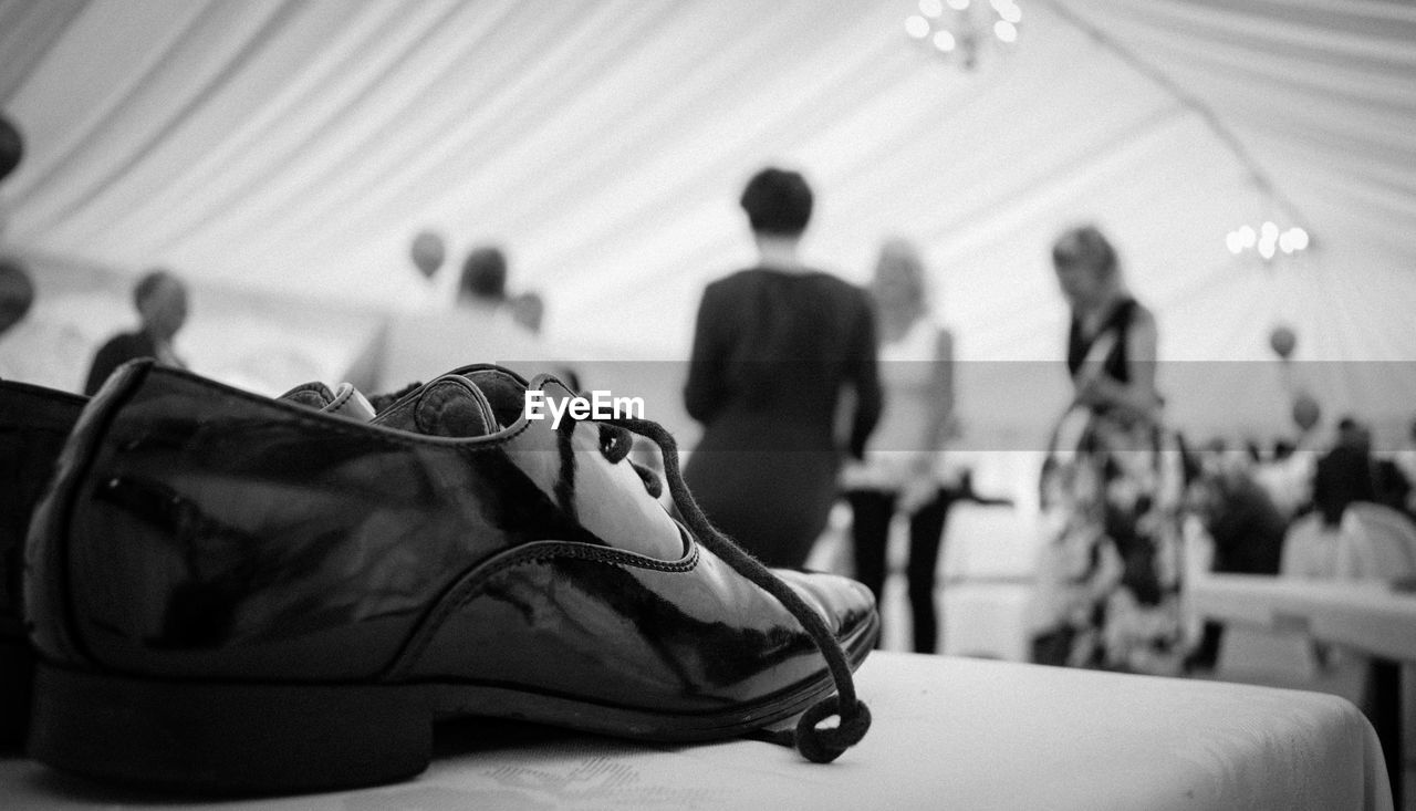 Close up of wedding shoe on table