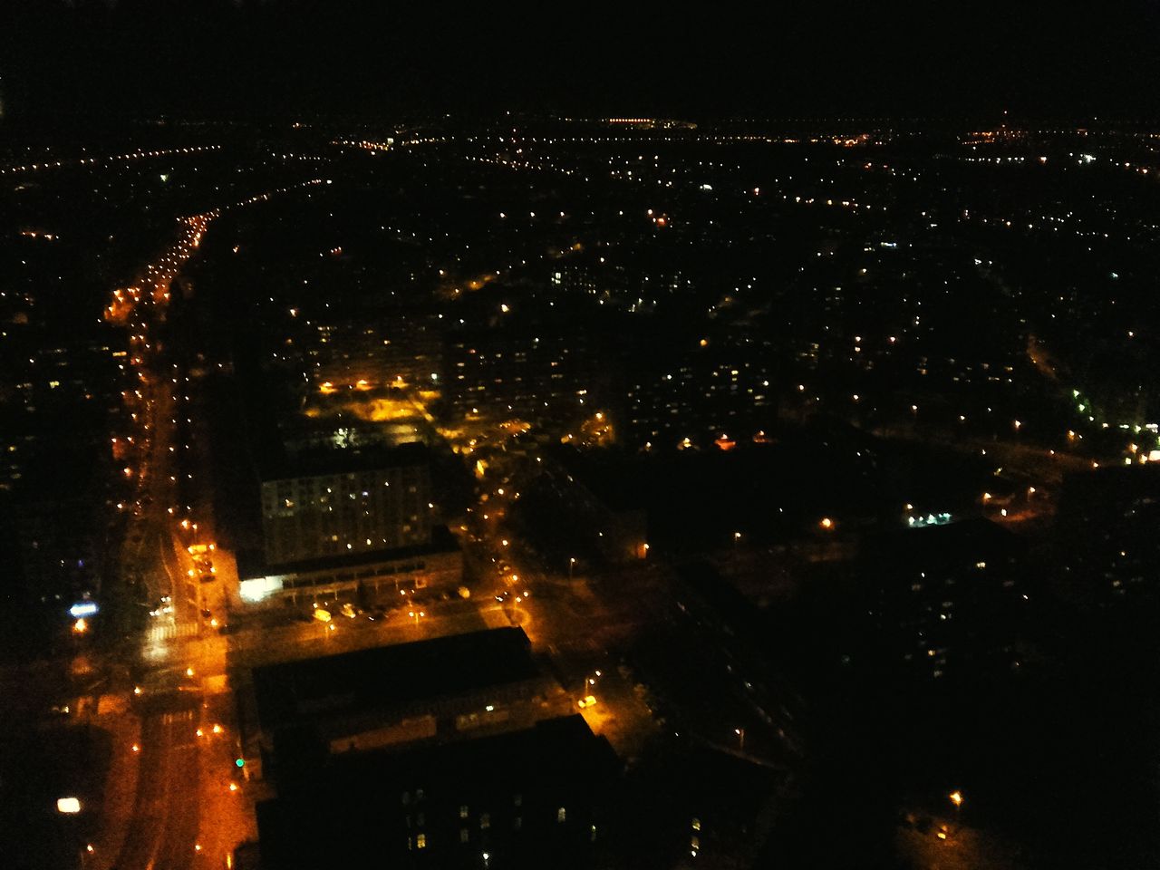 AERIAL VIEW OF ILLUMINATED CITY