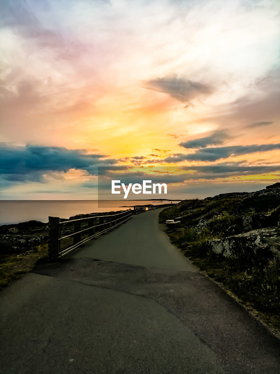 Road against sky during sunset