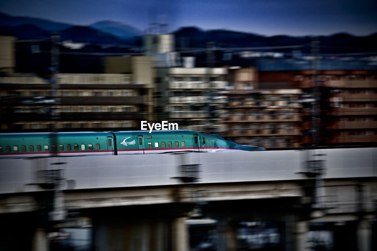 VIEW OF ILLUMINATED CITYSCAPE