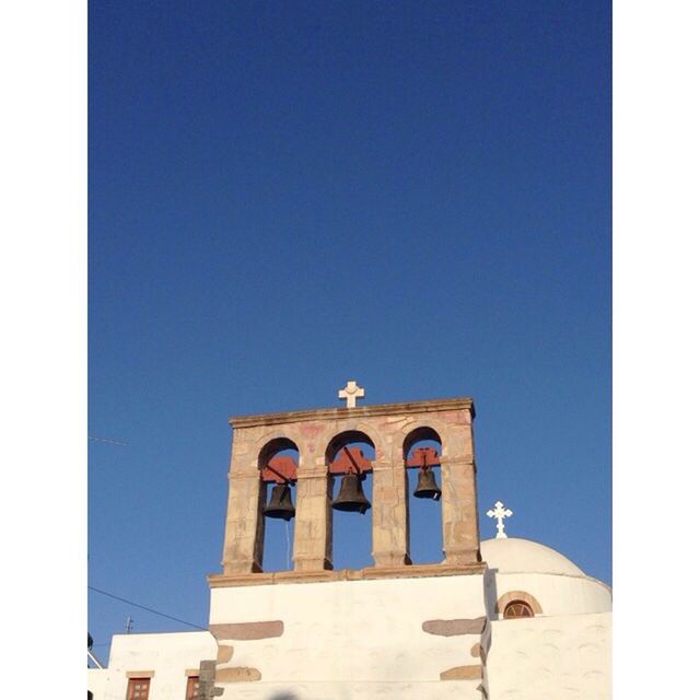 LOW ANGLE VIEW OF BUILT STRUCTURE AGAINST CLEAR BLUE SKY