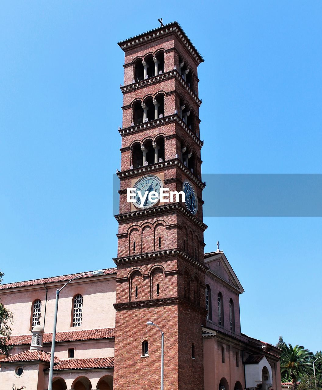 Low angle view of clock tower against clear sky