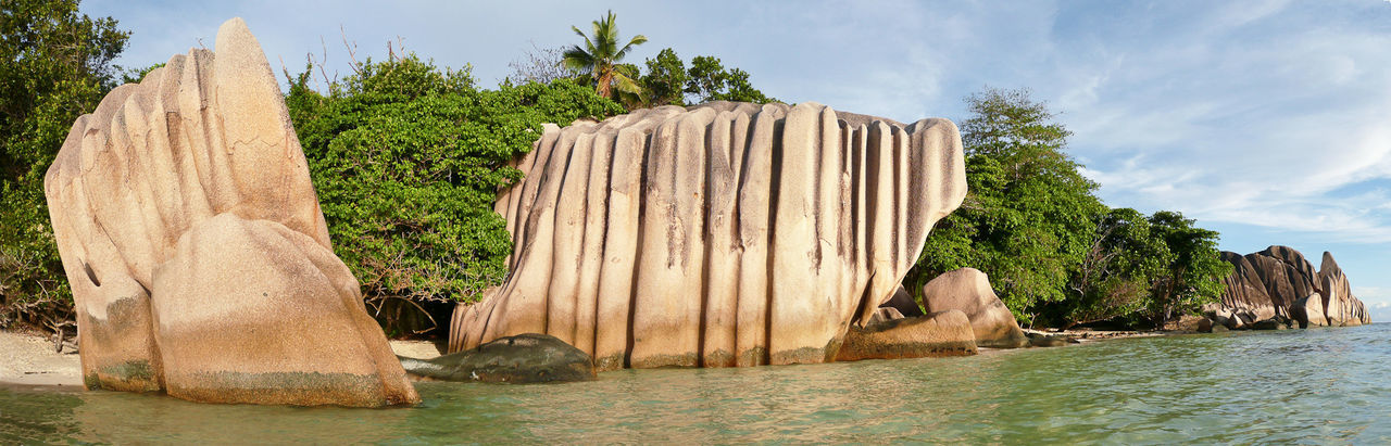 PANORAMIC VIEW OF ROCKS AGAINST SKY