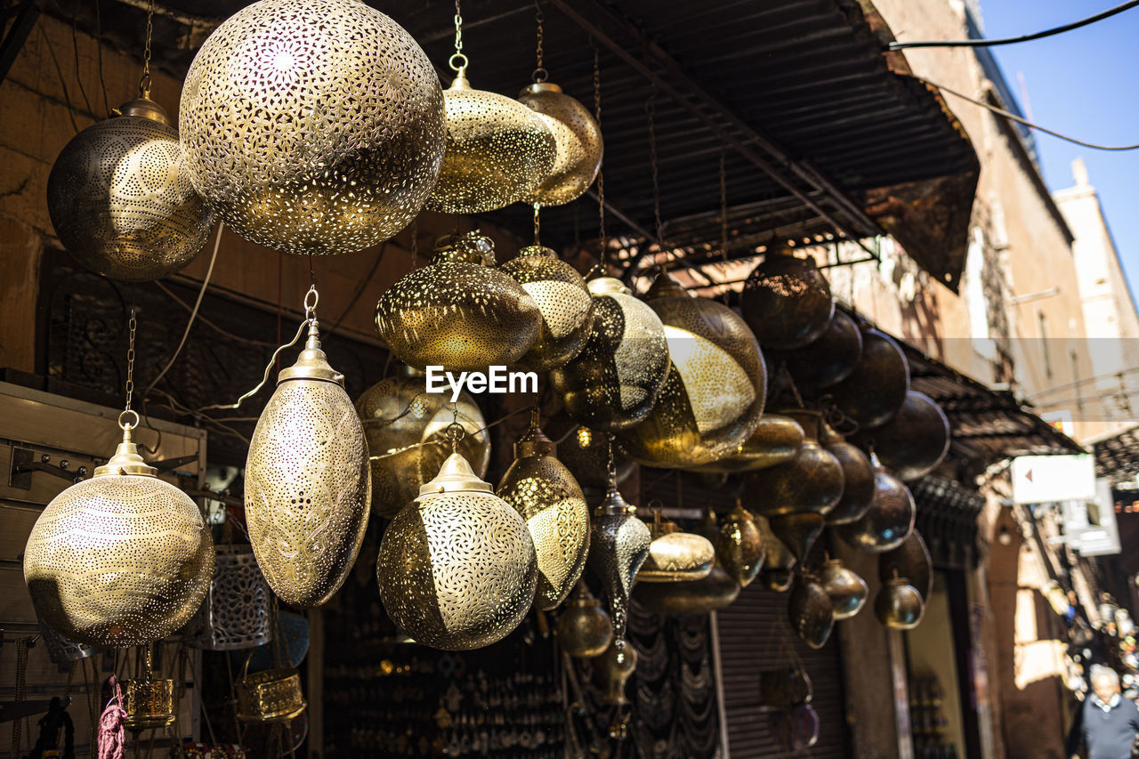 LOW ANGLE VIEW OF DECORATION HANGING AT MARKET