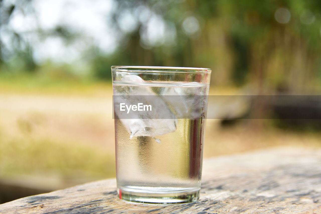 Close-up of tonic water glass on table