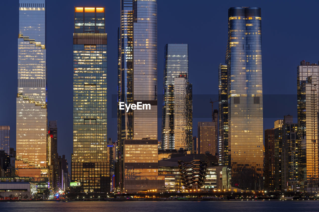Midtown manhattan and hudson yards skyscrapers panorama at dusk, new york