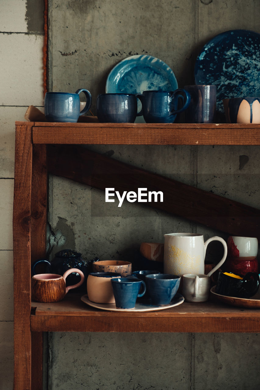 Crockery in shelves at home