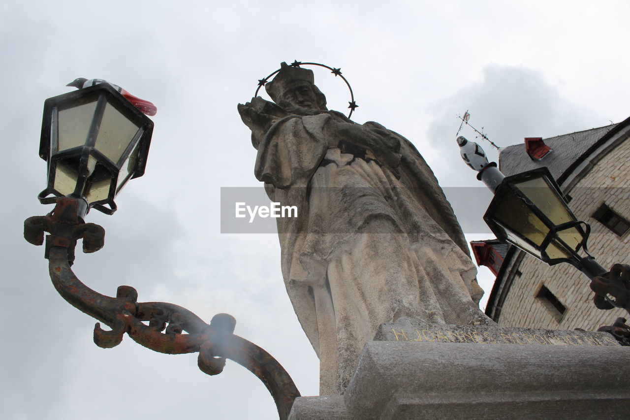 Low angle view of street light against sky