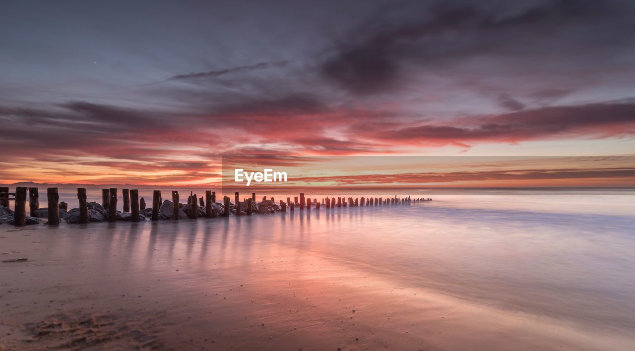 Scenic view of sea against sky at sunset