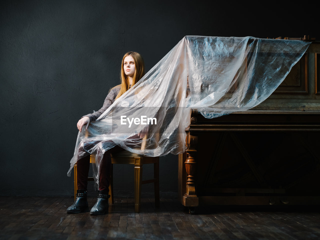 Portrait of woman sitting on chair