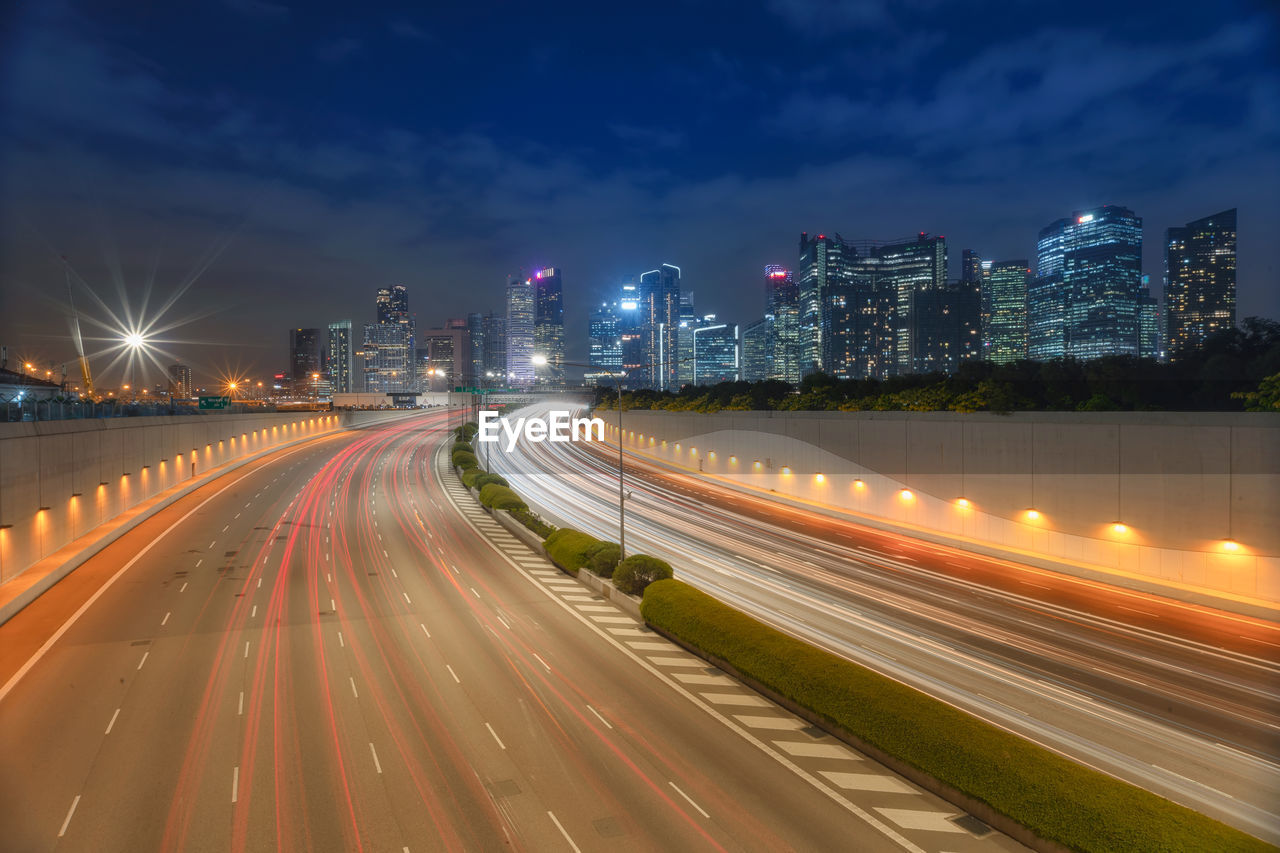 Singapore busy road and city with motion-blurred vehicle, car in singapore city highway.