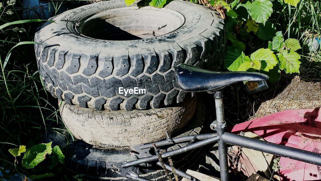 High angle view of tires and old bicycle