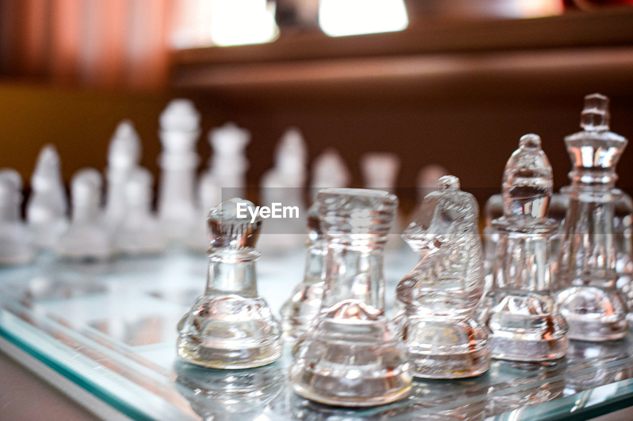 chess, game, board game, indoor games and sports, leisure games, sports, recreation, chess piece, chessboard, strategy, relaxation, tabletop game, leisure activity, indoors, pawn - chess piece, king - chess piece, no people, queen - chess piece, competition, glass, selective focus, knight - chess piece, focus on foreground, close-up, arts culture and entertainment, business