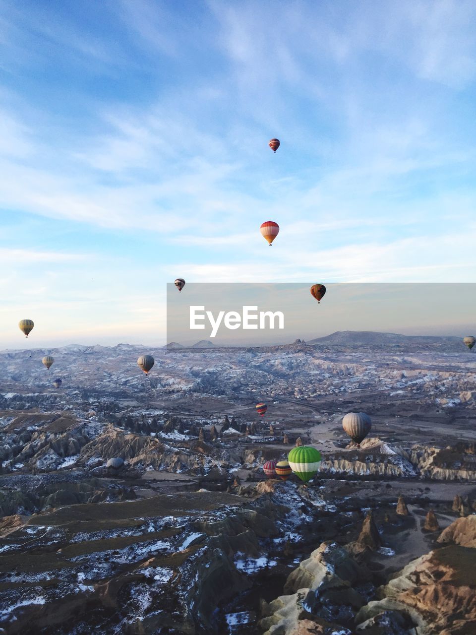 Hot air balloons flying over cappadocia in winter