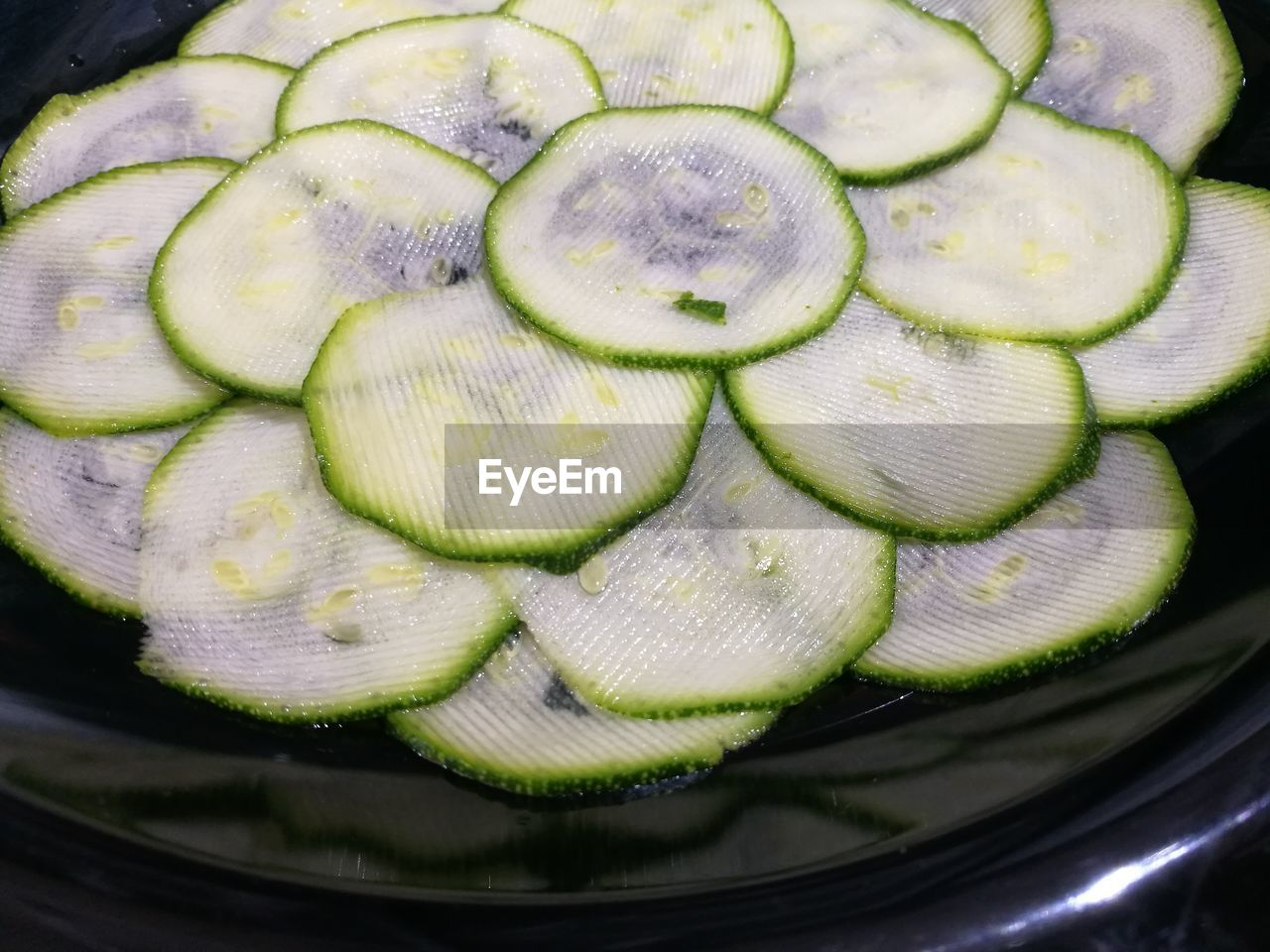 High angle view of fresh sliced zucchini in plate