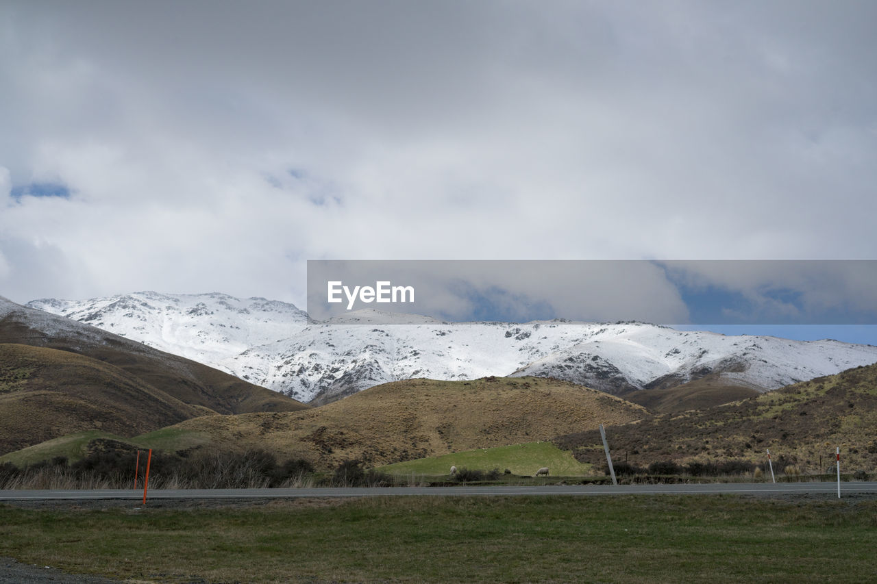 New zealand scenic view with snowcapped mountain at the end of winter season.