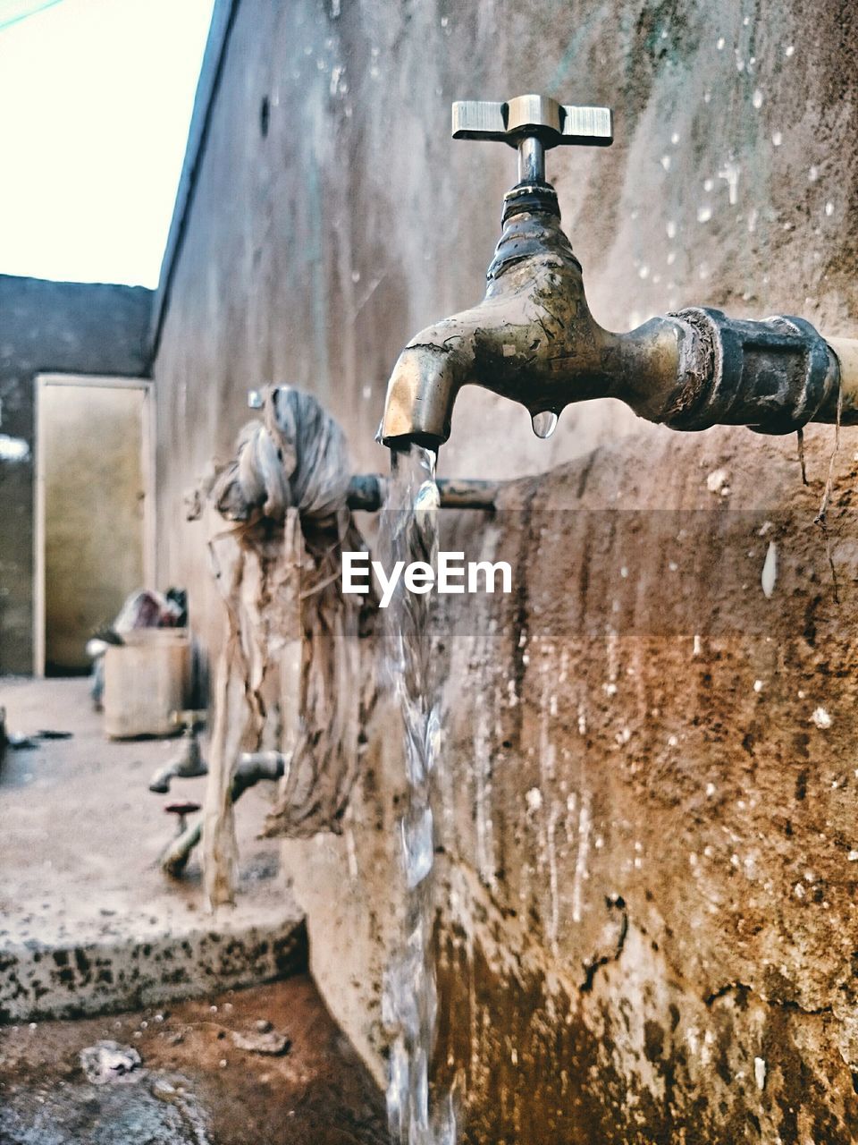 Close-up of water falling from faucet