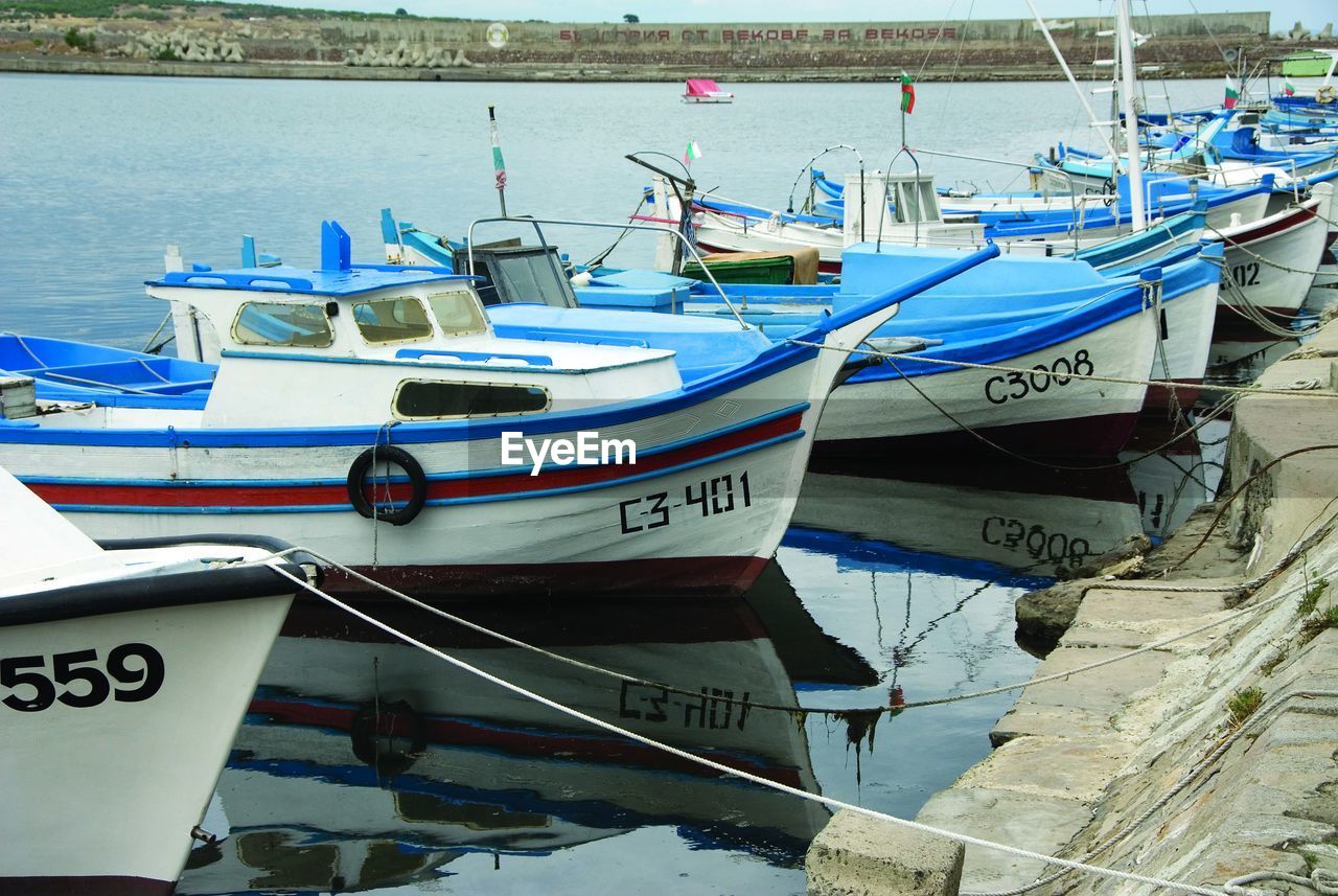 Close-up of boats moored on sea