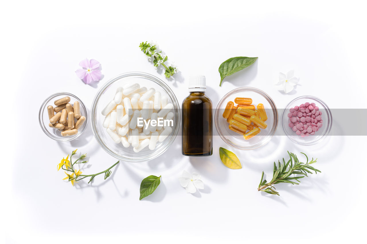 food and drink, food, herb, wellbeing, healthy eating, plant, freshness, vegetable, medicine, studio shot, white background, healthcare and medicine, no people, indoors, variation, ingredient, rosemary, high angle view, fruit, container, spice, leaf, nature, pill, plant part, nutritional supplement, still life, herbal medicine, flower, bottle