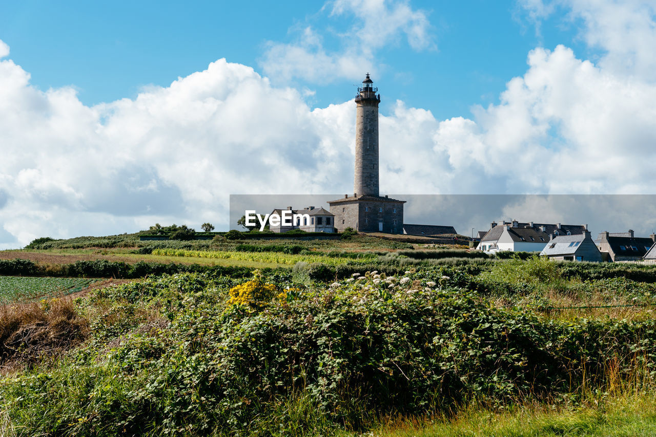 View of the island of batz and the lighthouse a sunny day of summer