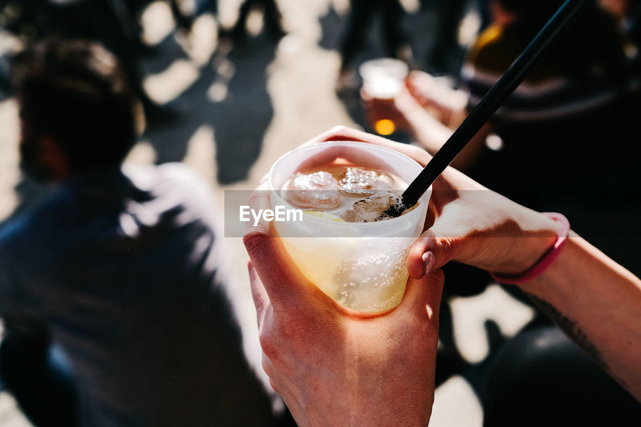 Close-up of hands holding a drink