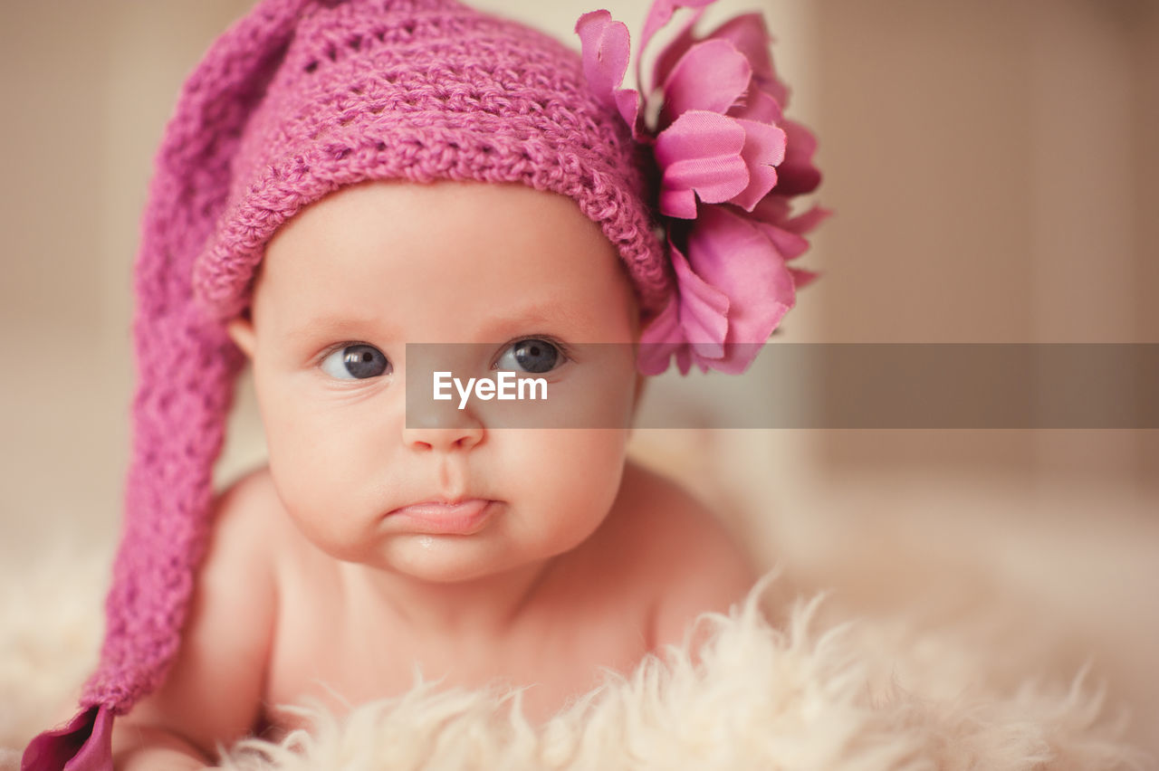 Close-up portrait of cute girl with flowers