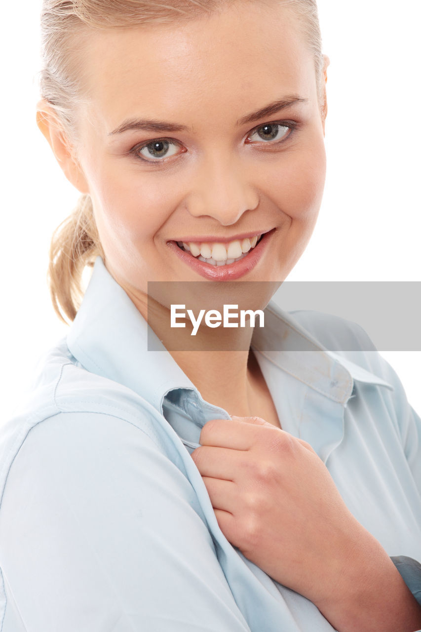 Portrait of businesswoman against white background