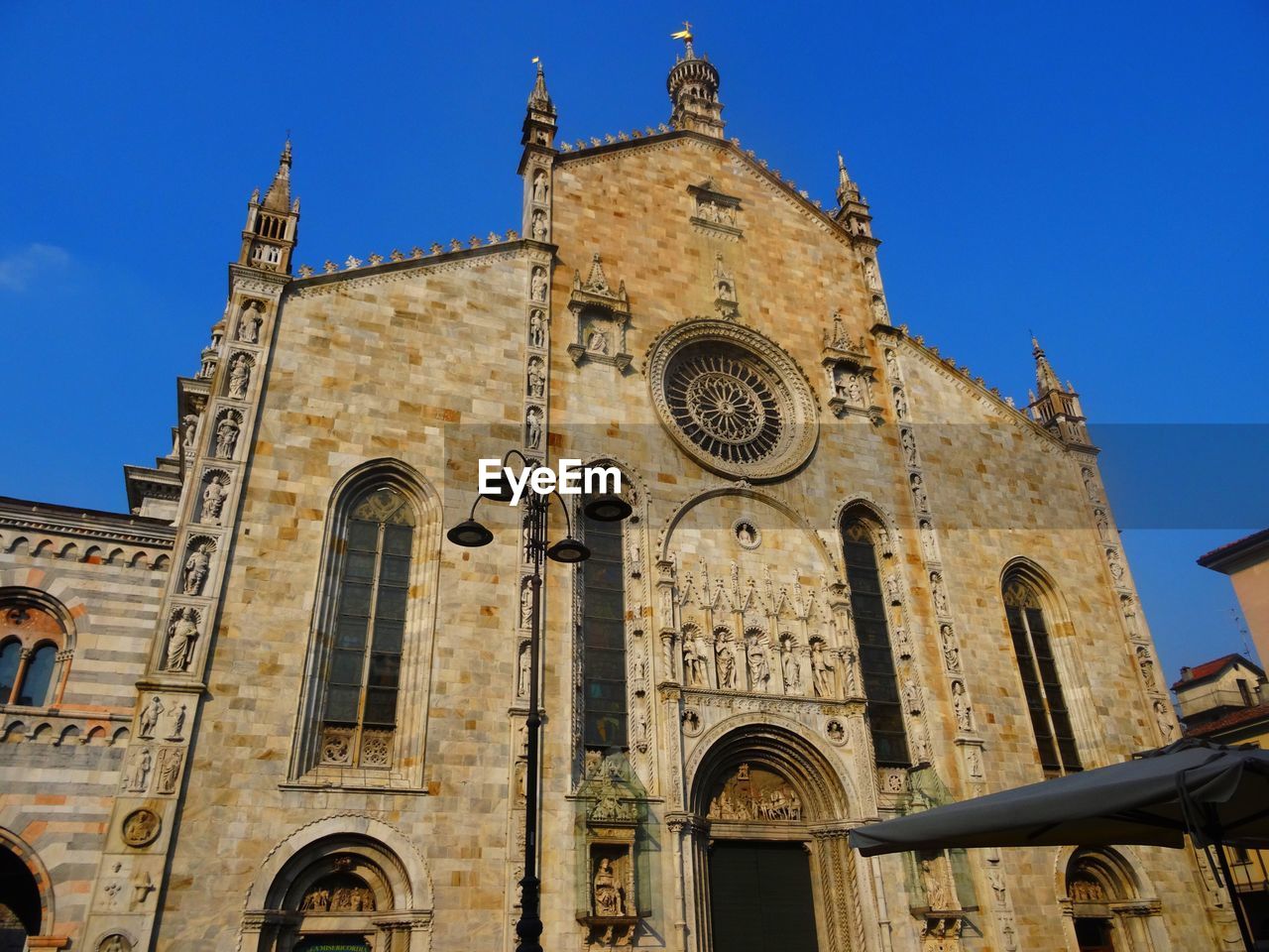 Low angle view of old building against blue sky