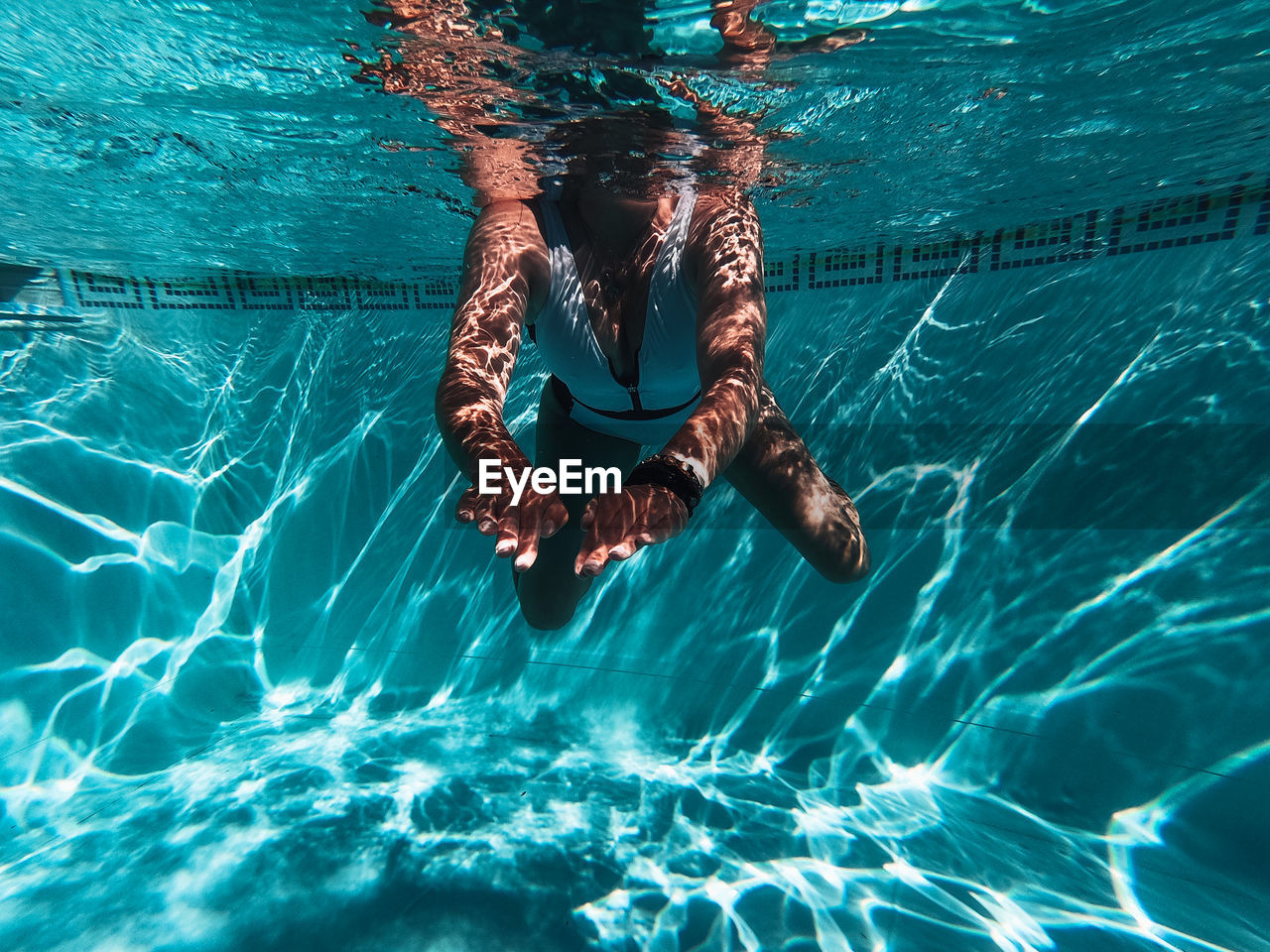 Woman swimming in pool