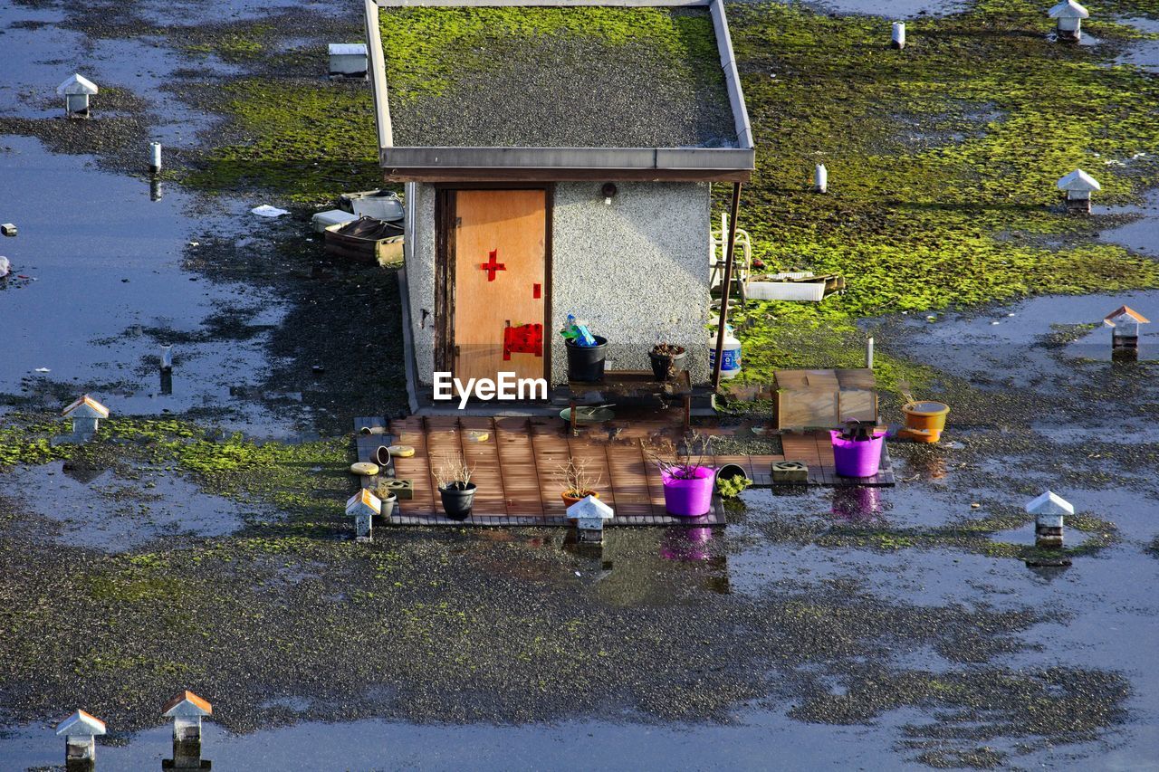 HIGH ANGLE VIEW OF PEOPLE IN WATER AT PARK