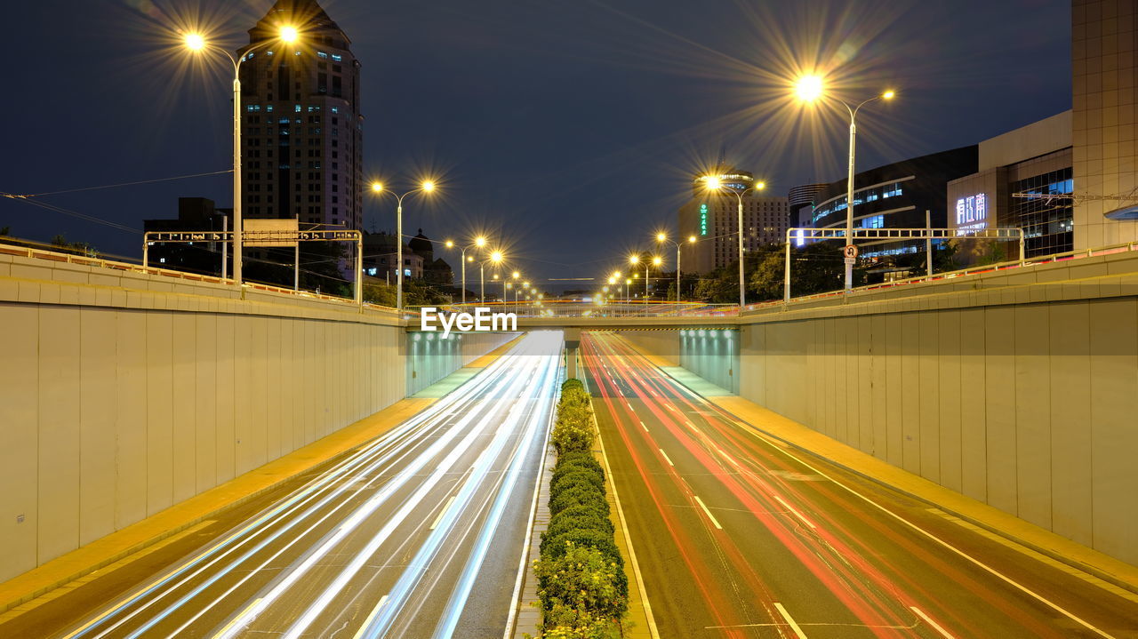 High angle view of light trails on road at night