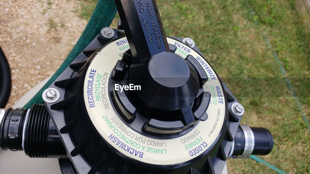 Close-up of valve with text