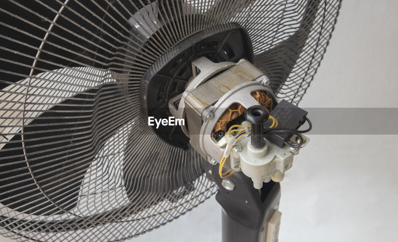 LOW ANGLE VIEW OF ELECTRIC FAN IN CONTAINER