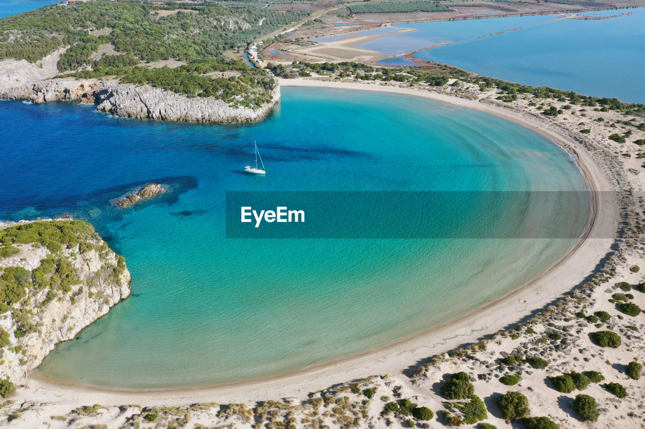 Aerial view on sailing yacht in dreamlike voidokilia beach lagoon near pylos greece